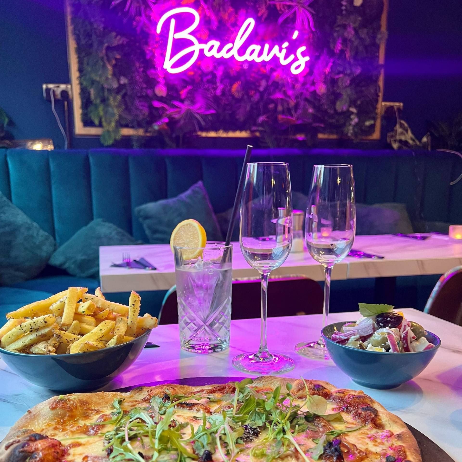 Cocktails and tapas beneath the pink Badavi’s sign
