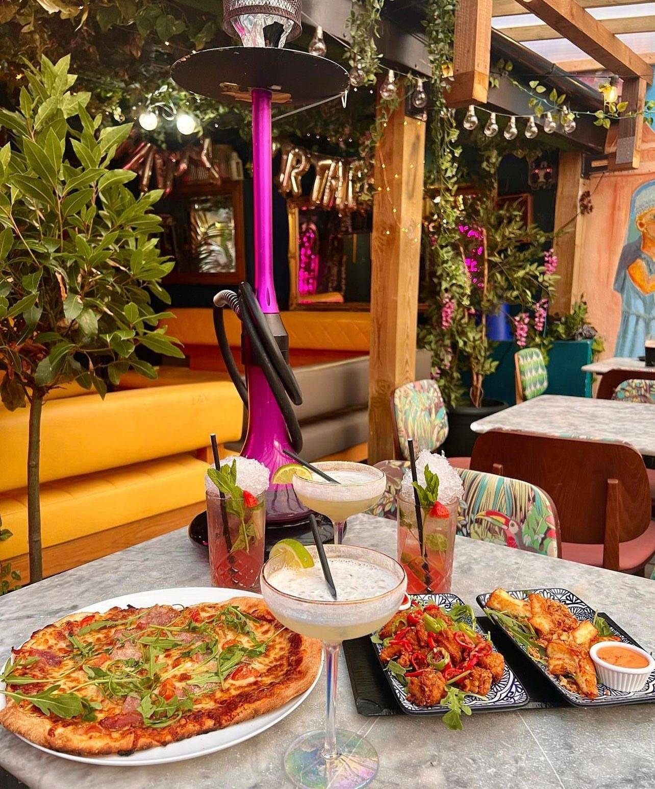 Cocktails and food on the leafy outdoor terrace